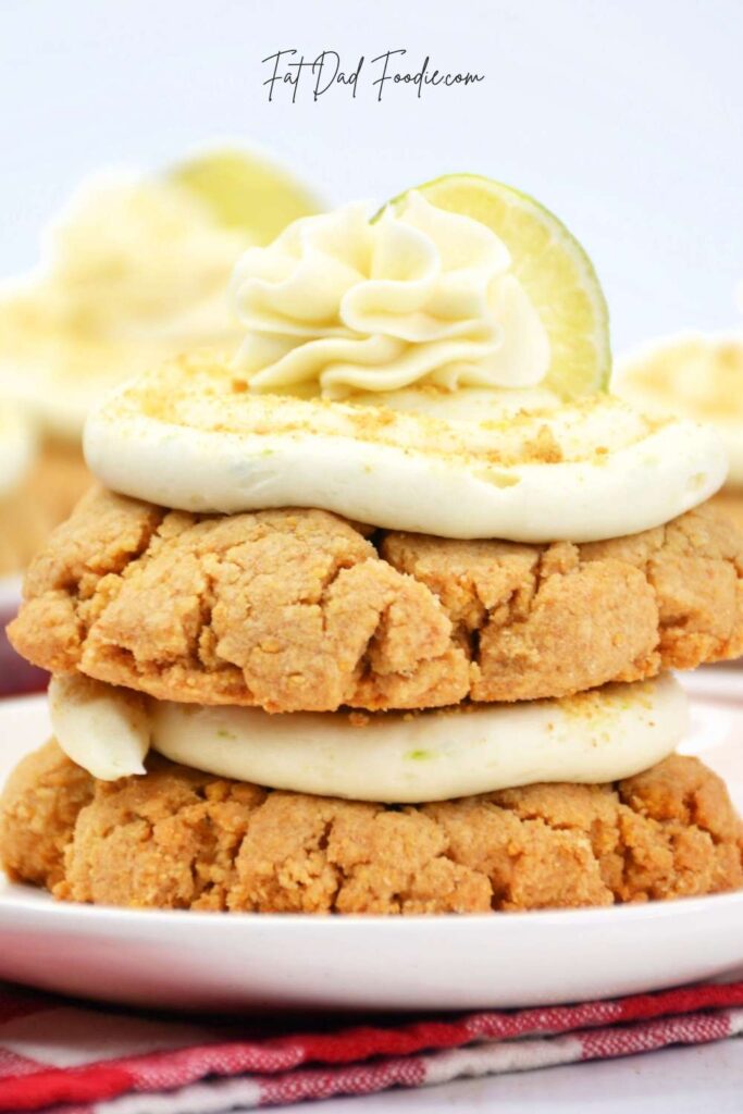 closeup of stacked key lime cookies with whipped cream on top