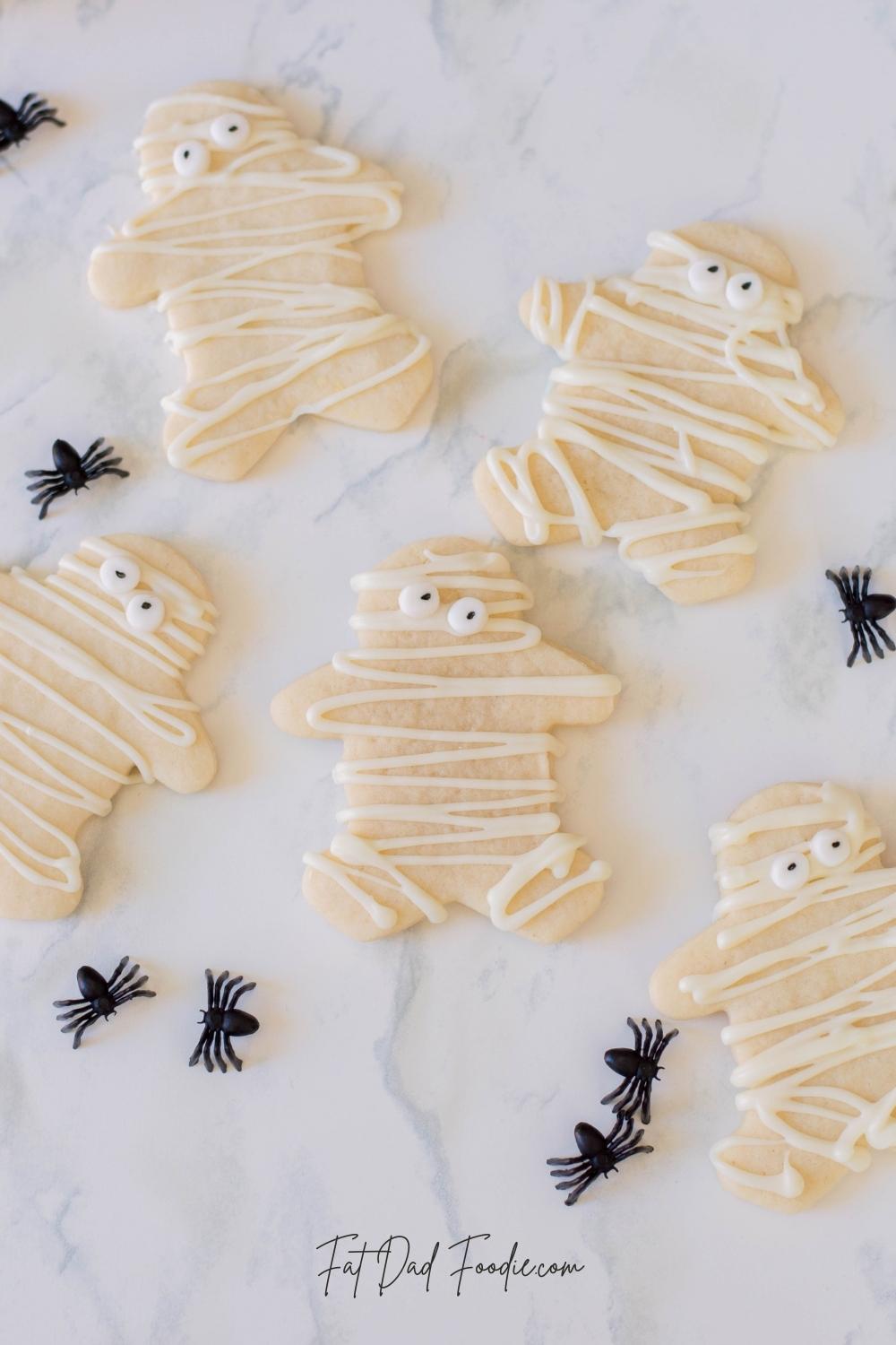 mummy cookies with spiders laying flat