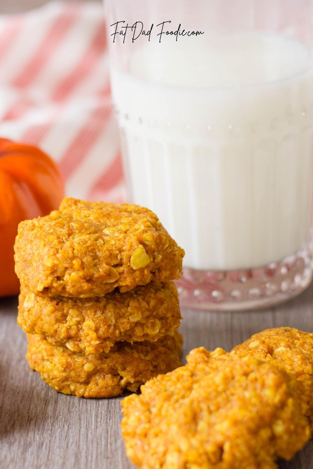 stacked no bake pumpkin oatmeal cookies with glass of milk