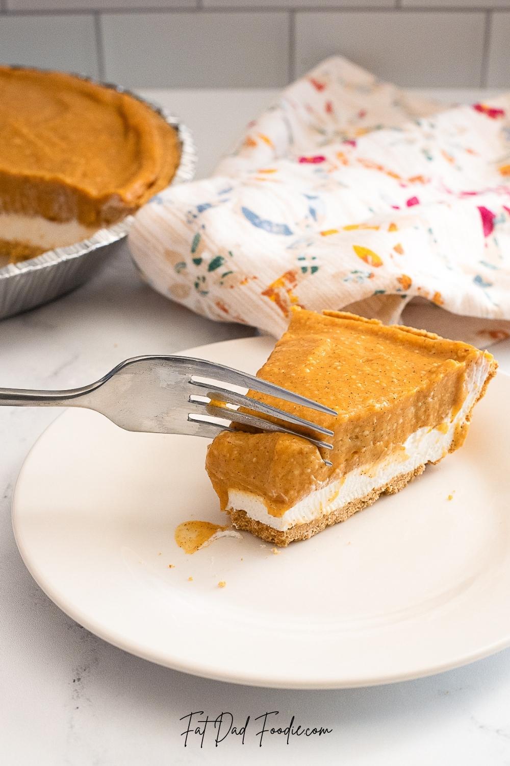 double layer pumpkin pie taking bite