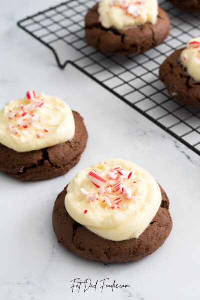 crumbl peppermint bark cookie on counter cooling rack