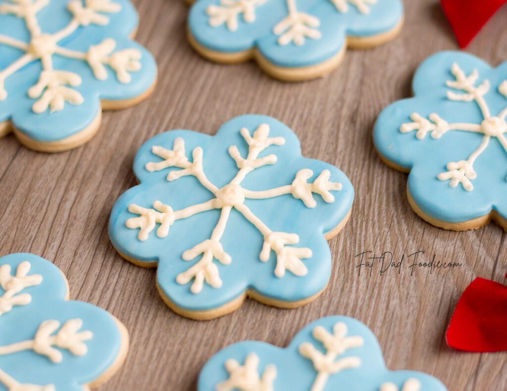 snowflake cookie recipe on wood