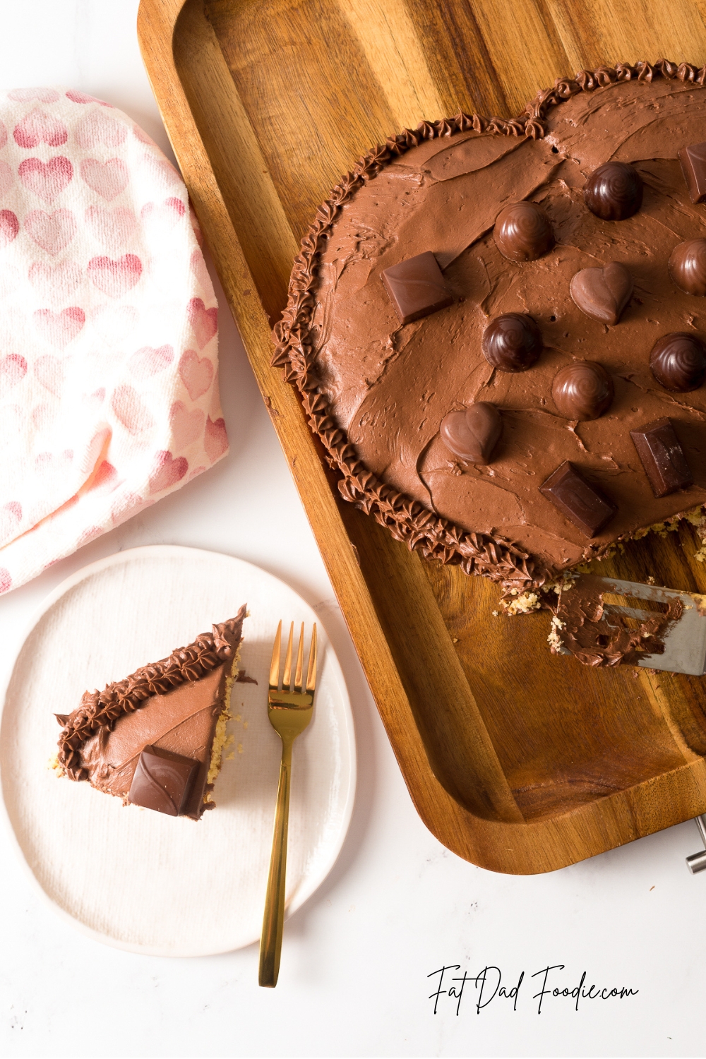 heart shaped chocolate candy cake with spatula
