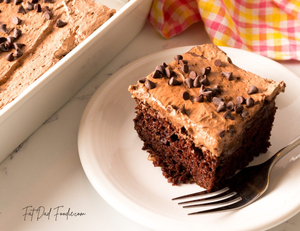 ultimate chocolate poke cake cut with fork
