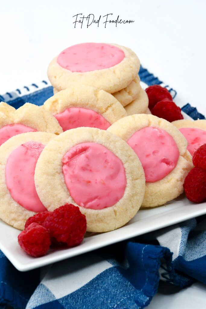raspberry thumbprint cookies with blue towel