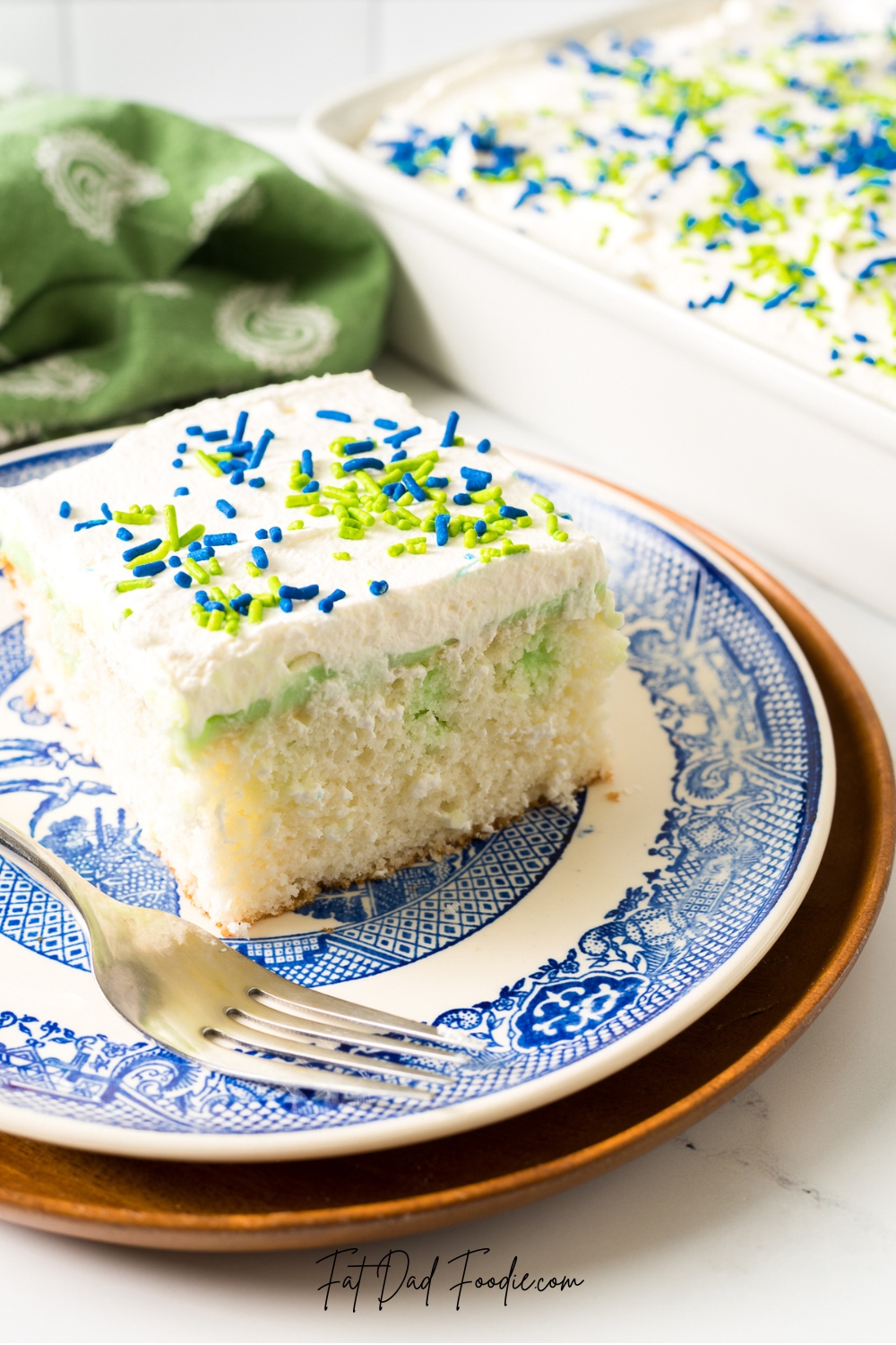 pistachio poke cake with cream fosting