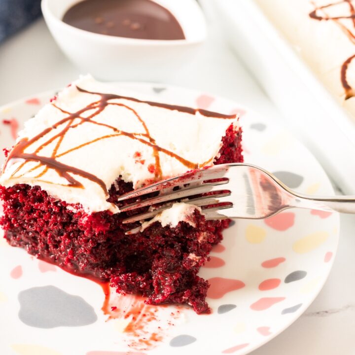 red velvet poke cake with chocolate sauce